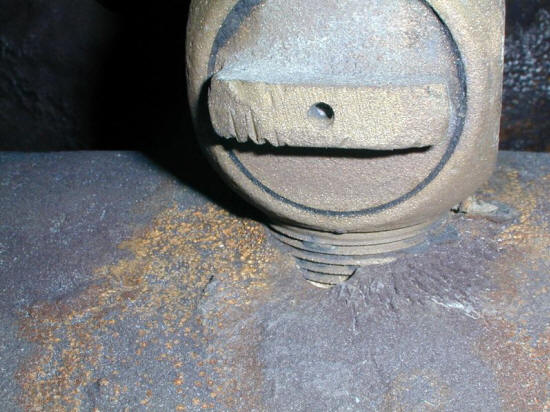 Corrosion of a water main ductile iron adjacent to a copper fitting