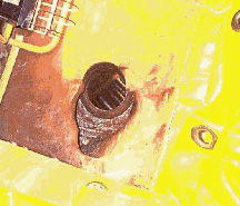 High pressure inside the reactor vessel pushed the stainless steel outward into the cavity formed by the boric acid